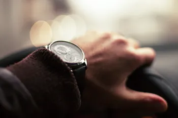 Hand on steering wheel